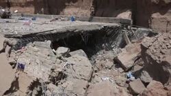 CLEAN : Iraq rescuers struggle to free six trapped in shrine hit by landslide News Clip