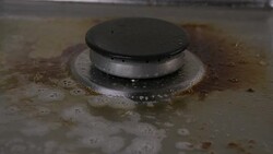 Spraying cleaning products on kitchen hob in slow motion Stock Footage