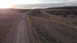 Aerial Drone Footage of Semi-Trucks Rolling Down the Highway Stock Footage
