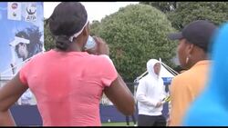 Venus and Serena Williams talking to eachother during practice News Clip