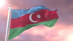 Azerbaijan flag waving at wind in slow at sunset, loop Stock Footage