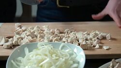 Couple cutting chicken meat Stock Footage