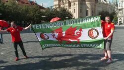 Wales fans in Prague holding a large flag News Clip