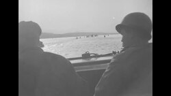 During Korean War, UN soldiers crossing wide body of water in jeeps and trucks in South Korea News Clip