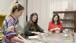Teacher showing flat clay to students in workshop Stock Footage