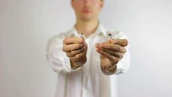 Man Breaking a Cigarette to Stop Smoking Stock Footage