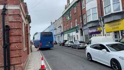 People arrive by coach to board the Bibby Stockholm barge News Clip
