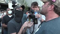 Pro Trump & Anti Trump Protesters cross paths outside Rally News Clip