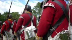 British Grenadier soldiers marching during Revolutionary War reenactment Stock Footage