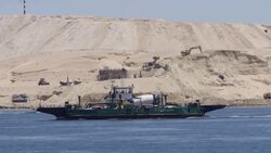 Boats moving through Suez Canal and construction works in background News Clip
