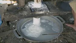 close up on a man pressing rice dough; Rice noodles are cooked in boiling water straightaway Stock Footage