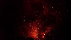 Glowing Lava Blasts Into Air During Explosive Volcanic Eruption At Night Stock Footage