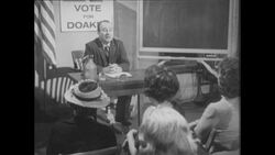 1960s: People sit in chairs in meeting room, smoke cigarettes Stock Footage