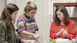 Tilt down shot of teacher cutting clay by students Stock Footage