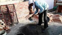 Worker mixing cement on construction site. Stock Footage