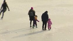 People ice skate on Edinburgh's frozen Inverleith Park pond News Clip