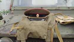 Brown russian soldier uniform on the top of the military jeep Stock Footage