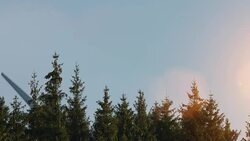 Wind turbines and agricultural fields on a summer day Stock Footage