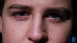 eyes of a sad young boy crying - bullying, adolescence, suffering Stock Footage