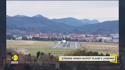 Strong winds buffet plane's landing News Clip