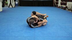 How to Do a Triangle Choke from Guard Using Head Control Instructional Video