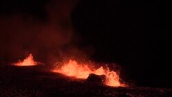 CLEAN : Red lava spews from Iceland volcano eruption at night News Clip