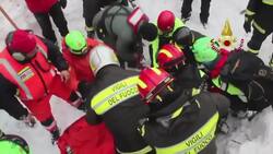 Rescuers pull 2 people from buried hotel in Italy News Clip