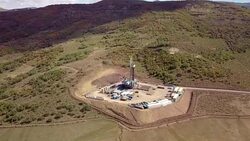 Aerial View of a Fracking Drilling Rig in the Autumn Mountains of Colorado Stock Footage