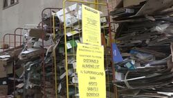 People maintain social distancing in line for supermarket News Clip