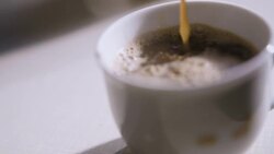 Pouring fresh made coffee into a cup Stock Footage