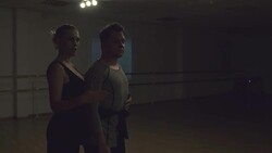 Man and a woman are dancing in the studio Stock Footage