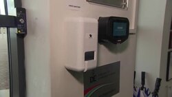 Hand sanitizing station outside school News Clip