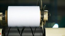 White yarn spools of industrial warping machine in textile factory Stock Footage