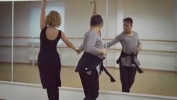 Man and a woman are dancing in the studio Stock Footage