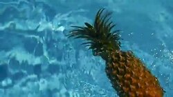 Pineapple Floating In blue Water In Swimming Pool. Healthy Raw Organic Food. Juicy Fruit. Vegetarian, Vegan Nutrition, Vitamins, Diet, summer holidays, vacation concepts. Exotic tropical background Stock Footage