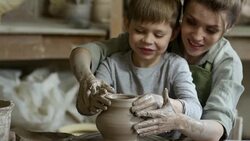 Woman and Boy Throwing Vase on Pottery Wheel Stock Footage