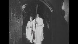 Procession of altar boys at UK church; congregation singing News Clip