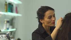 Beautiful young girl in a beauty salon Stock Footage