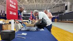 Volunteers pick up official Ryder Cup gear at Hofstra ahead of golf event News Clip
