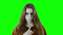 Hush-hush! - teenage girl, disguised for Halloween or a costume party, against a green screen Stock Footage