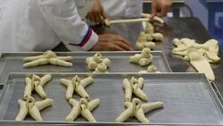 hands making bread in baker factory horn shape Stock Footage