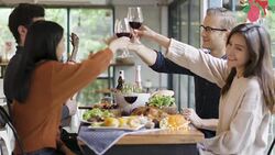 christmas eve party dinner gruop of caucasain and asian friends drink and conversation together with happiness and joyful wonderful moments Stock Footage