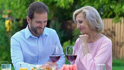 Adult son spending time with his beautiful mature mother, family values, love Stock Footage