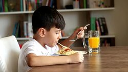 Boy eating spaghetti Stock Footage