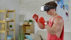 Man in VR Goggles Training at Home Stock Footage