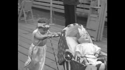 Contestants parade with dolls in Chicago baby parade News Clip