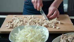 Woman cutting chicken meat Stock Footage