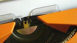 Close up footage of a person writing WORLD WAR III on an old typewriter Stock Footage