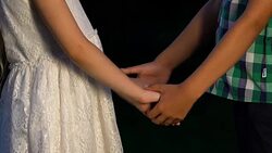 Little boy taking girls hands and kissing her, cute moments, innocent friendship Stock Footage