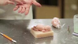 How to Shape a Baby Figurine Cake Decoration out of Fondant Instructional Video